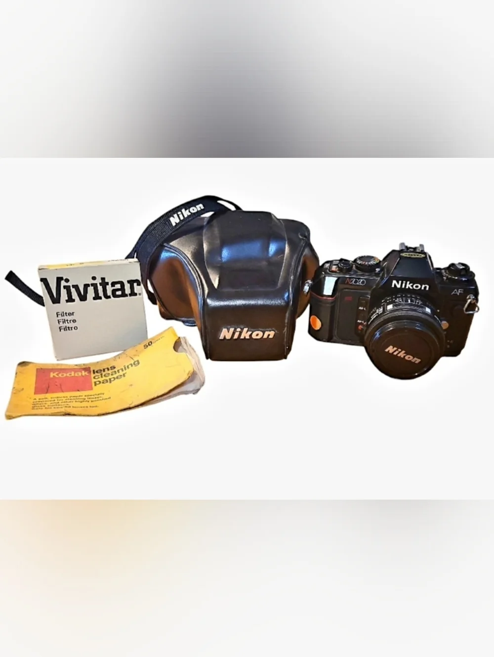 Nikon N2020 AF Film CAMERA, LEATHER CASE + HAZE LENS